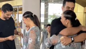 Neha Dhupia Breaks Down In The Arms Of Angad Bedi At The Airport After He Shows Her His Gold Medal