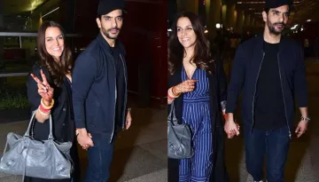 Newly-Weds Neha Dhupia And Angad Bedi Leave For Honeymoon, Pose Hand In Hand At The Airport