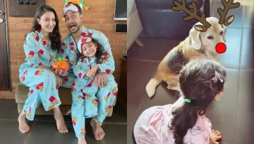 Inaaya Naumi Kemmu Looks Adorable In A Pink Dress As She Receives A Gift From Santa Claus