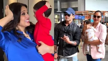 Bipasha Basu Holds Baby Devi Close To Her, The Latter Is Amused By The Hustle-Bustle At The Airport