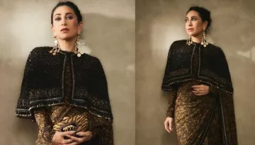 Karisma Kapoor Wore A Golden Sabyasachi Saree Paired With Black Cape, Tiger Earrings And A Clutch