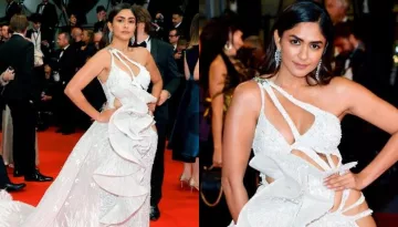 Mrunal Thakur Raises Temperature In An Ivory Risque Cut-Out Gown With A Long Trail At Cannes 2023