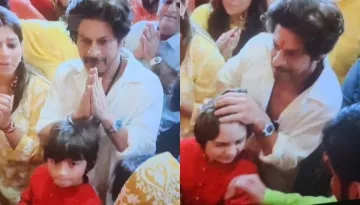 Shah Rukh Khan Pays Visit To Lalbaugcha Raja With AbRam, Pulls His Hair Up For 'Tika'
