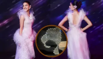 Radhika Merchant Slips Into A Lavender Dress With A Sparkly Boa Scarf, And A Diamond Ear Cuff