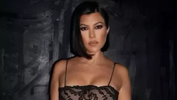 Kourtney Kardashian Turns The Iconic 'Travis I'm Pregnant' Concert Sign Into A Framed Home Decor