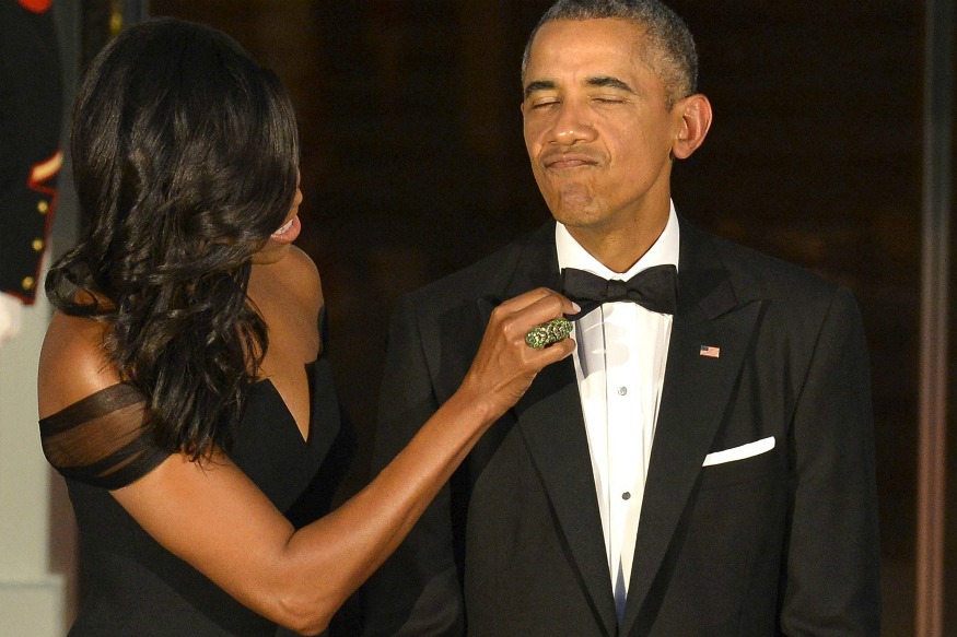 Michelle adjusting Barack  Obama Tie