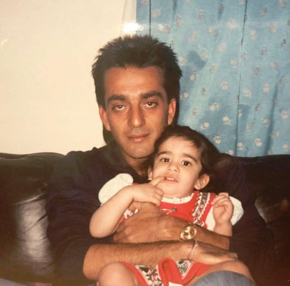 Young trishala sitting on sanjay dutt lap