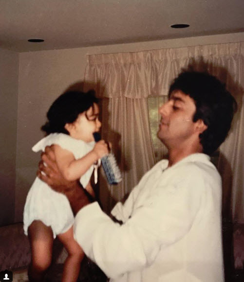 Young trishala sitting on sanjay dutt lap