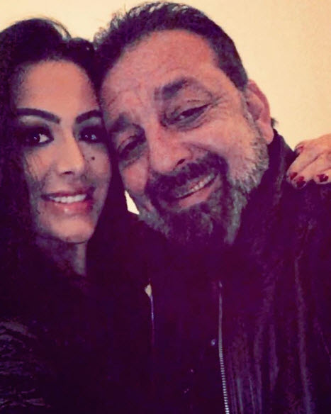 Young trishala sitting on sanjay dutt lap