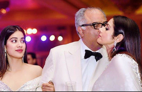 Boney Kapoor kissing Sridevi while Janhvi looks
