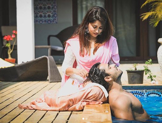 Dipika and Shoaib in a pool