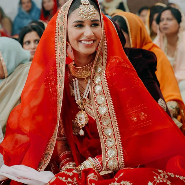 Hasleen Kaur red Sabyasachi lehenga