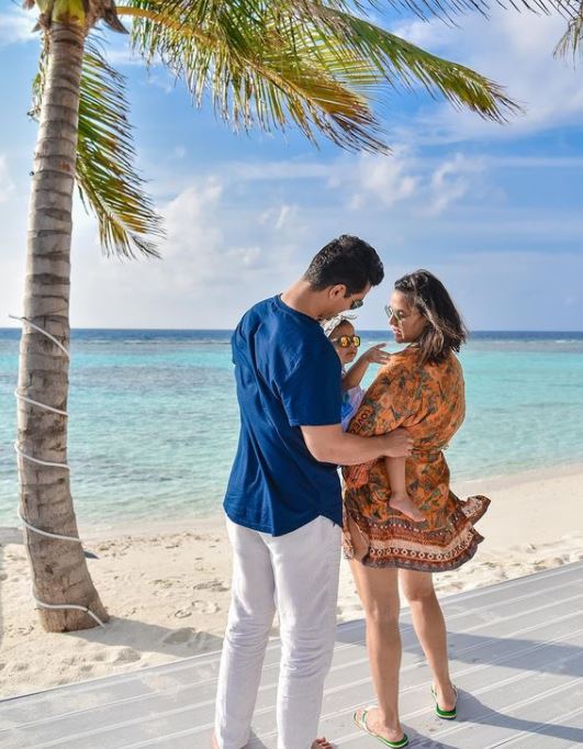 Neha Dhupia and Angad Bedi with their daughter