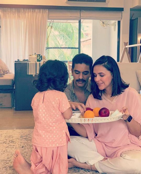 Neha Dhupia and Angad Bedi with their daughter