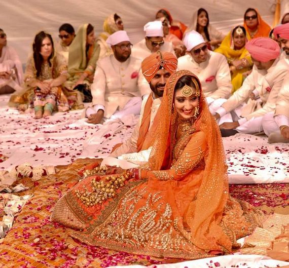 Sabyasachi orange jacket lehenga for bride