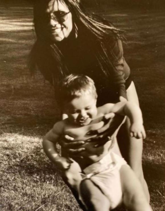 Brooklyn Beckham with Victoria Beckham