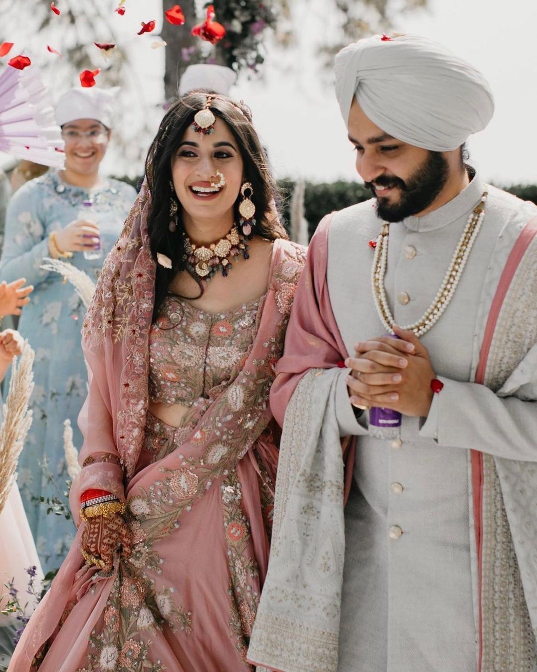The Bride Donned A Rose Pink 'Lehenga' With Open Hairstyle For Her Day  Wedding