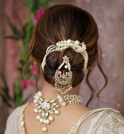 Indian bride's reception hairstyle created by Swank Studio | Indian bridal  hairstyles, Bridal hairdo, Indian bridal outfits