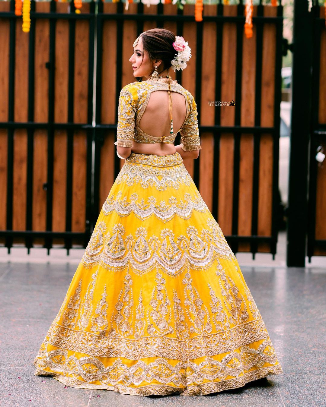Manish Malhotra - Rejoice a timeless #nooraniyat in a delightful canary  yellow hue organza lehenga designed with all-over floral motif embroidery  accompanied by our tonal #Noor bodice and sheer scalloped drape!  #Nooraniyat - @