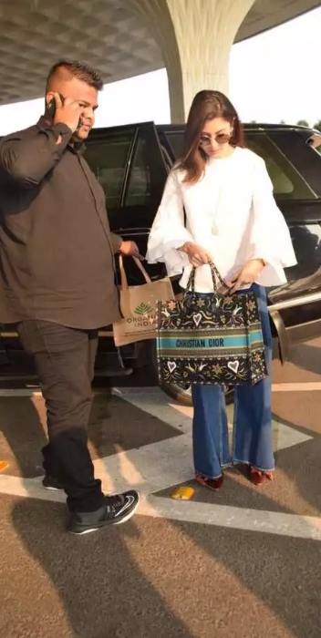 Anushka Sharma completes her Airport look with Christian Dior Bag