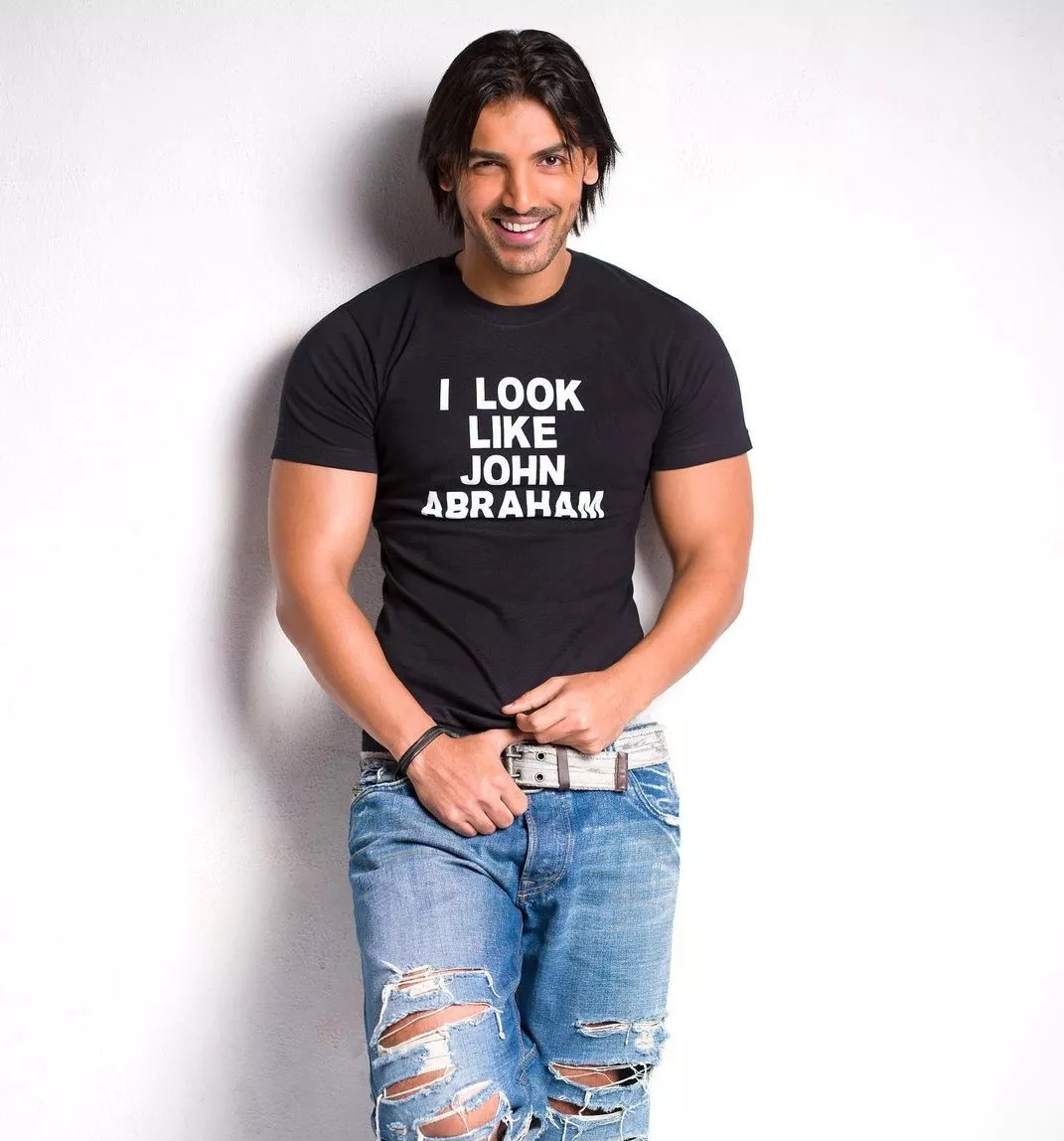 Smiling movie star john abraham posing for a photo on Craiyon