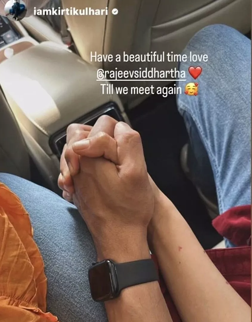 The couple holding hands.