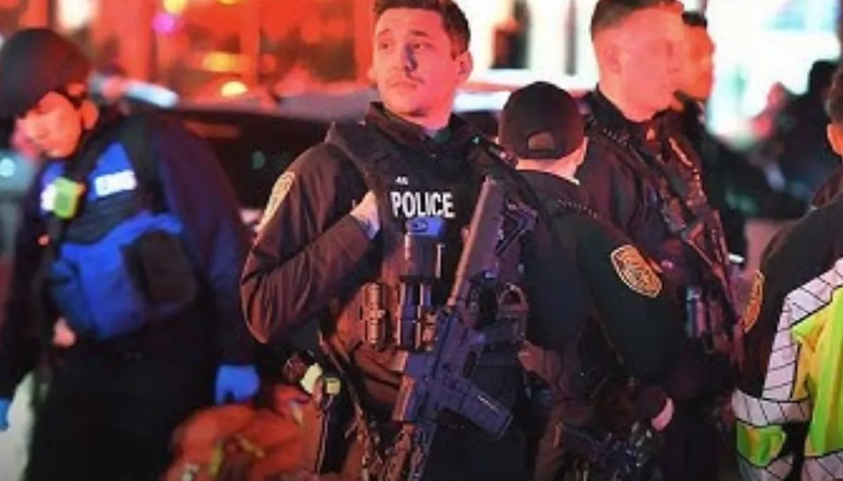 Benjamin Erickson is detained in a Rhode Island hotel as police name 24-year-old as person of interest in Brown University shooting