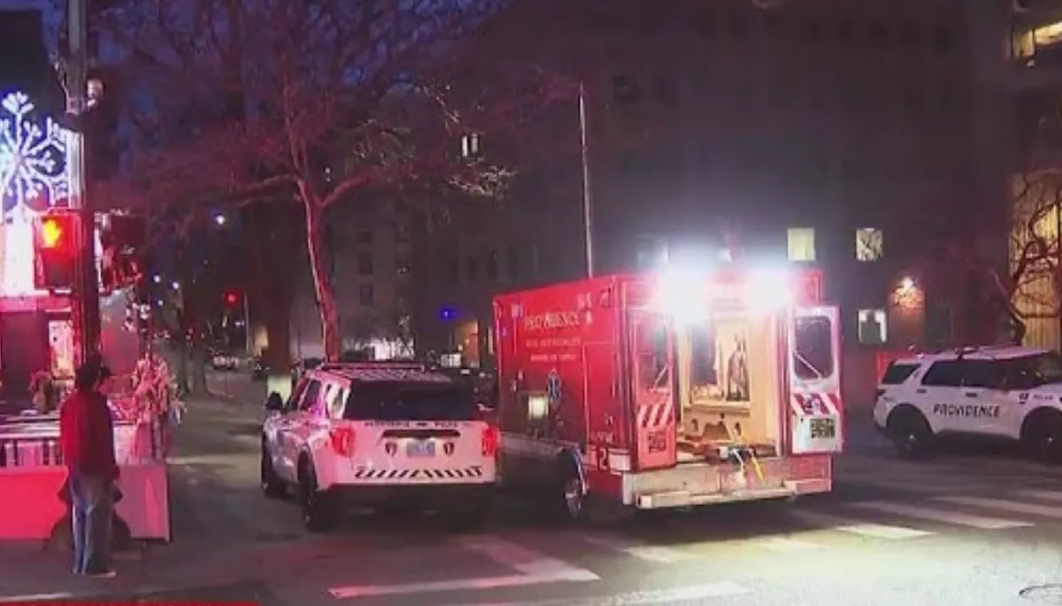 Benjamin Erickson is detained in a Rhode Island hotel as police name 24-year-old as person of interest in Brown University shooting