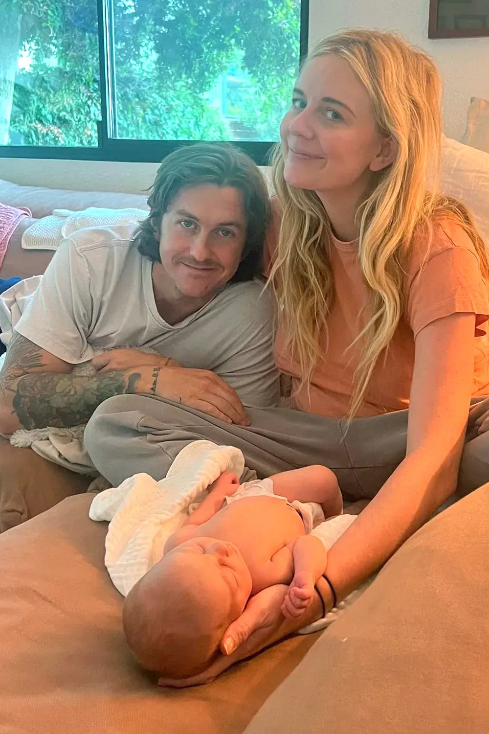 Justine Lupe with husband and daughter