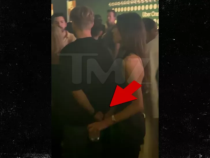 Kyle Cooke holding hands with mystery woman