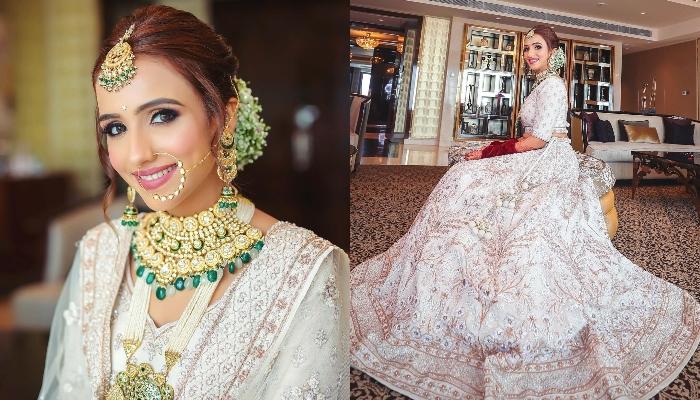 The Bride Opts For A Unique White 'Lehenga' With Fuschia Pink 'Chooda' And  'Doli Kaleeras'