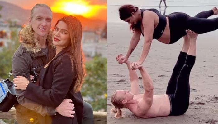 Mom-To-Be, Aashka Goradia Flaunts Baby Bump While Performing Acro Yoga Pose With Hubby On A Beach