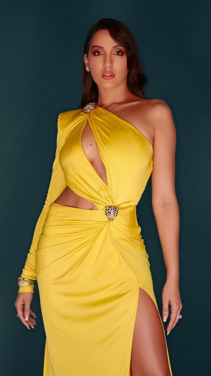 green emerald velvet dress Nora Fatehi Gleams Like The Glamazon She Is In A Gorgeous Liquid Gold Gown